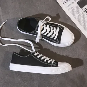 Scarpe di tela personalizzate in PVC a buon mercato all'ingrosso della fabbrica scarpe da ginnastica bianche nere da uomo in tela scarpe alla moda scarpe da passeggio