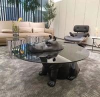 Table basse GEDO 2026 au design innovant avec base en résine de fibre de verre et plateau en verre haut