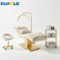 Nouveau style : Ensemble lit de soin et chariot à base dorée, lit SPA vert haut de gamme pour centre de bien-être féminin, table de massage électrique réglable