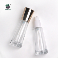 Nouveau design de bouteilles cosmétiques en verre transparent vides de 30ml avec distributeur de pompe à lotion à bec en plastique de 20mm pour la crème