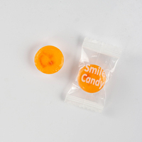 Bonbons ronds en gros à motif imprimé, bonbons fourrés saveur orange, bonbons colorés pour enfants et friandises de fête en vrac OEM