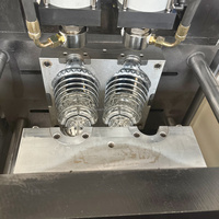 Machine de soufflage semi-automatique de haute qualité pour la fabrication de bouteilles d'eau en PET de 5 litres, machine de moulage par soufflage de bouteilles en plastique