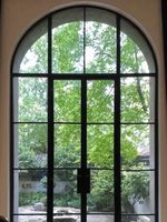Porte d'entrée en verre cintrée de style français, porte coulissante en aluminium de style antique