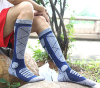Vente en gros de chaussettes de ski unisexes tricotées d'hiver de haute qualité pour l'extérieur avec logo sur la manchette