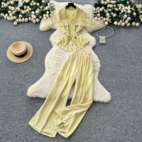 Ensemble pantalon taille haute et pantalon large élégant d'été pour femme, avec haut sans manches à revers boutonné et ceinture, idéal pour le bureau et les trajets quotidiens