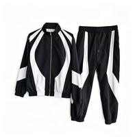 Ensemble survêtement coupe-vent homme noir et blanc color block, grande taille, veste et pantalon en nylon, style Gorpcore Streetwear, personnalisable OEM ODM, tendance
