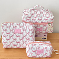 Vente en gros de sacs de maquillage de voyage pochette moelleuse matelassée avec nœud fermeture à glissière stockage portable sac cosmétique cadeau