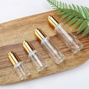 Wholesale Slim Cylinder Serum <b>Glass</b> <b>Bottles</b> 15ml 20ml 30ml 50ml with Push Button Press Pump <b>Dropper</b> Cap for Cosmetics - Product Image 1