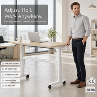 Bureau debout réglable manuel minimaliste avec manivelle, cadre métallique, options de couleur, table d'ordinateur mobile sur roulettes, vente en gros pour la maison