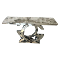 Table à manger minimaliste italienne moderne de luxe, structure en acier inoxydable de qualité supérieure, plateau en pierre frittée écologique, salle à manger d'hôtel