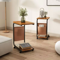 Mesa de centro lateral moderna simple del lado de la sala de estar multiusos para el diseño interior con la rueda