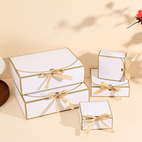 Boîte cadeau blanche minimaliste avec bordure dorée, ruban brun et fermeture à nœud, ensemble d'emballage cadeau haut de gamme imprimé quadricolore, vente en gros en vrac