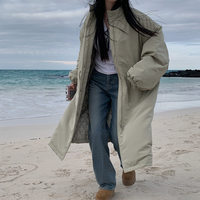 Manteau long matelassé en coton pour femme, style parka chic d'hiver, coupe ample avec cordon de serrage et col montant, chaud et douillet