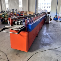 Machine de formage à rouleaux pour coudes de gouttières et de descentes d'eau en fer, avec moteur, boîte de vitesses, pompe et roulement