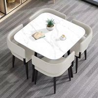 Table et chaises de salle à manger rondes en dalle de roche, style minimaliste italien de luxe léger, pour petits appartements