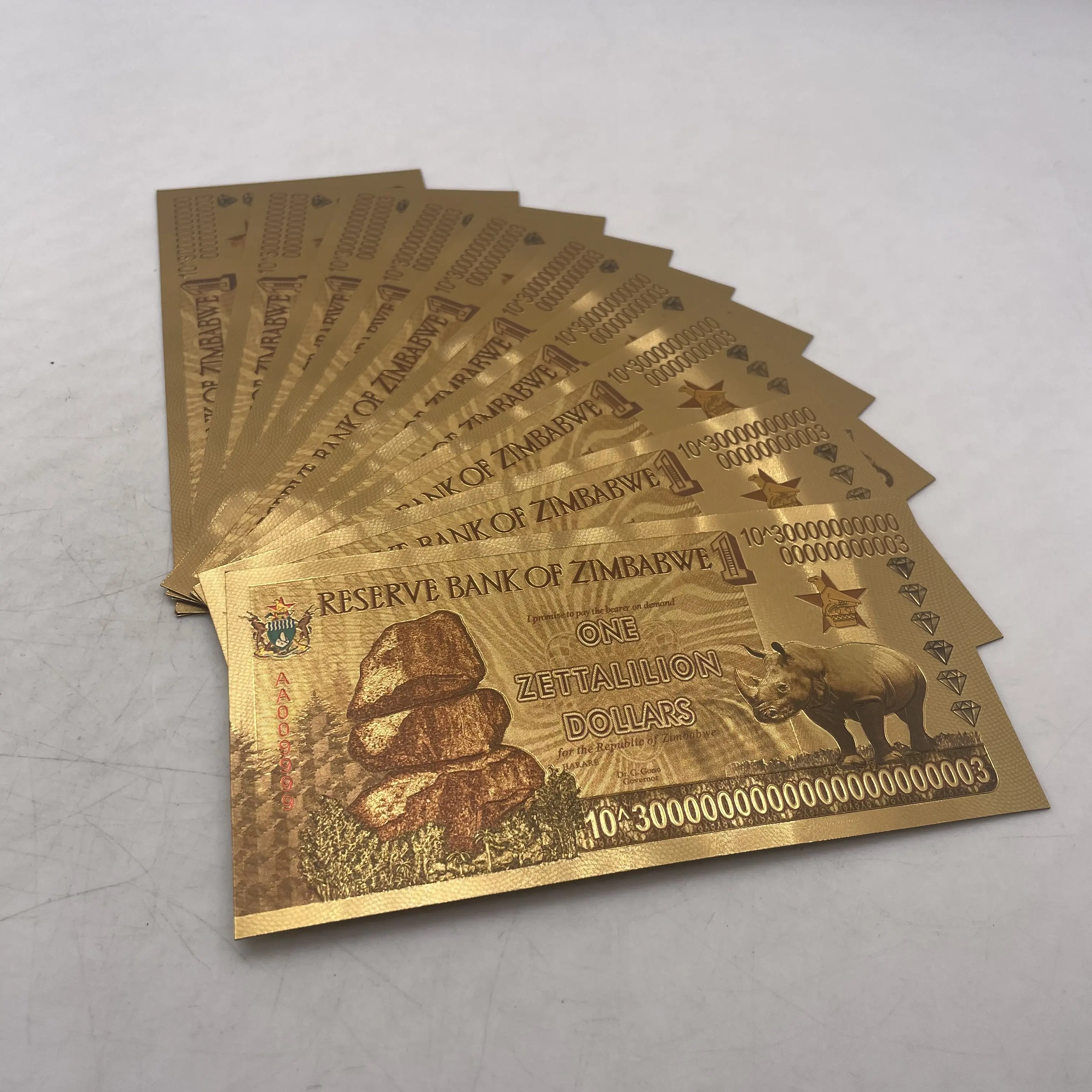 थोक जिम्बाब्वे एक ZETTALILION डॉलर सोने बैंकनोट यूवी प्रकाश के साथ रिजर्व बैंक का ध्वज पत्थर बिल स्मारिका के लिए नोट्स