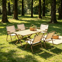 Ensemble de camping pliable moderne pour l'extérieur, table en bois et acier et chaises en tissu, écologique, portable pour le glamping et les pique-niques