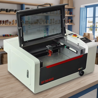 Graveur et graveuse laser CO2 3040 40W refroidi par eau pour métal/caoutchouc avec configuration de table de travail