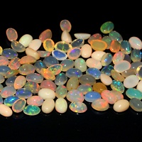 Cabochon éthiopien en opale Welo calibré de forme ovale pierre précieuse naturelle changement de couleur plaine en vrac pour bijoux bague prix de gros