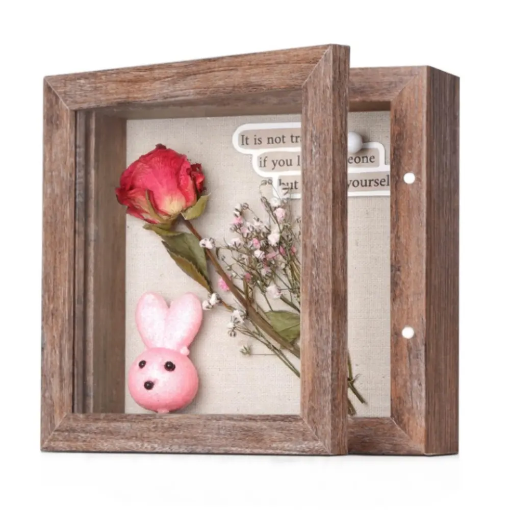 صندوق ظل صغير وهو صندوق عرض بذاكرة بسيط قوي له إطارات للزهور والصور وال ميداليات وغيرها