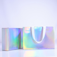 Fourniture directe d'usine emballage cosmétique pliant personnalisé parfum cadeau argent emballage réfléchissant sac en papier et boîte en papier costume