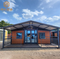 Villa modulaire en acier préfabriquée de luxe haut de gamme, type conteneur pliable à double aile extensible, avec toit en pente et balcon