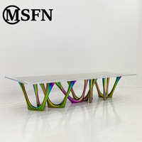 MSFN Direktvertrieb Luxuriöser Moderner Kunst-Esstisch Skulpturale Gesinterte Steinplatte Verschlungene Edelstahlbeine Apartment