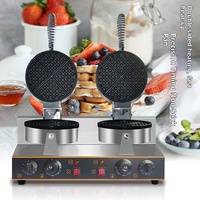 Gaufrier professionnel double tête rotatif en acier inoxydable antiadhésif pour la préparation de gaufres aux œufs, idéal pour les commerces de snacks et les restaurants.