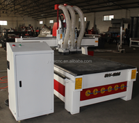 Machine de fraisage CNC pour le bois 1325 avec commande PLC, moteur pas à pas et broche à refroidissement par eau pour la production de meubles en petite entreprise