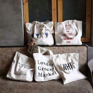 กระเป๋าผ้าแคนวาสขนาดใหญ่แบบกำหนดเองพร้อมโลโก้พิมพ์ลายตามสั่ง กระเป๋าผ้าแคนวาสขนาดเล็กสำหรับใส่ของช้อปปิ้ง - Product Image 1