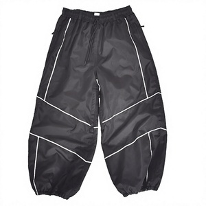 Pantalones de Nieve Negros Impermeables para Hombre con Ribete Reflectante, Pantalones Aislantes de Invierno con Cordón Ajustable en la Cintura y Dobladillo Elástico - Product Image 1