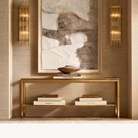Table console scandinave haut de gamme en métal doré, deux niveaux en verre, cadre tubulaire carré fin, pieds plats pour entrée, personnalisable OEM/ODM