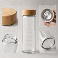 Bouteille d'eau transparente en verre borosilicate naturel moderne de 16 oz et 35 oz avec couvercles en bambou pour les voyages et le camping