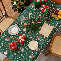 Nappe de Noël en jacquard, base verte avec motif Père Noël et bonhomme de neige, nappe à franges, protection de table saisonnière pour les dîners de fêtes