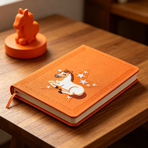 Agenda en tissu orange à couverture rigide avec motif cheval et étoile brodé, reliure cousue, idéal pour offrir - Product Image 1
