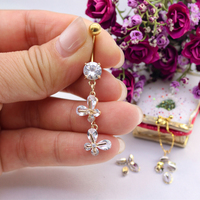 Xinfocus 2026 Nouvelle conception Anneaux de nombril en cristal Acier inoxydable Piercing de nombril Plaqué or Bijoux de corps pour femmes et hommes