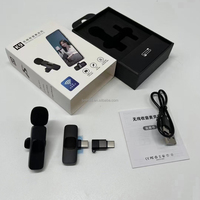 Produk laris mikrofon Lavalier 2.4GHz 1Drag 2 K9 mikrofon portabel klip nirkabel Lavalier Live konferensi untuk ponsel iphone dan Android