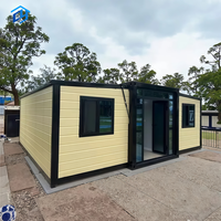 Maison conteneur modulaire préfabriquée pliable à double aile extensible, personnalisée en usine, pour hôtels, bureaux et projets de camps