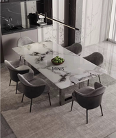 Meubles de salle à manger modernes pour la maison, fabriqués en Chine, table à manger rectangulaire en marbre naturel haut de gamme et stable avec chaises confortables.