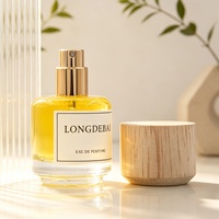 Nouvelle conception de flacon de parfum miniature rond en verre transparent de 30 ml, flacon de parfum vide avec bouchon en bois et boîte d'emballage