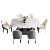 Meubles de salle à manger Table à manger en marbre avec base en acier inoxydable doré de luxe léger avec chaise