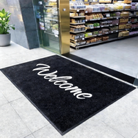 Tapis de bienvenue modulaire en nylon noir avec logo blanc pour l'hôtellerie, antidérapant, anti-poussière et anti-sable, pour usage commercial extérieur et entrée principale