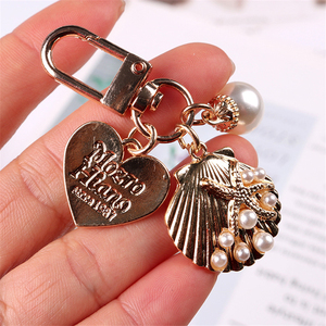 Llavero con Forma de Corazón y Perlas de Concha para Niñas, Accesorio Nuevo 2026, para Bolsos y <span class=keywords><strong>Airpods</strong></span> - Product Image 3