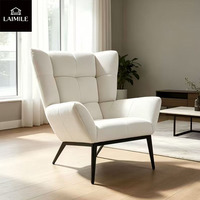Fauteuil lounge confortable en velours rembourré à dossier haut de style nordique, idéal pour le salon, la chambre ou la salle d'accueil