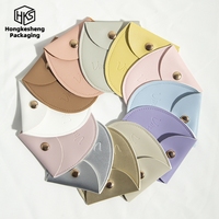 Sac à bijoux ovale personnalisé avec logo, en cuir PU multicolore, avec bouton, pour ranger colliers, boucles d'oreilles, bagues et bracelets