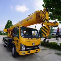 Grue mobile montée sur camion Xinfeigong 10 tonnes, flèche à 7 sections, hauteur de levage 32 m, portée 6 m, double treuil, moteur, pompe, roulement
