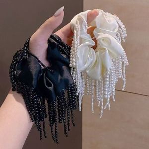Élastiques à cheveux en tissu faits main de haute qualité, écologiques, noirs et blancs, avec perles et pompons, accessoires pour queue de cheval - Product Image 1