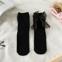 Chaussettes en dentelle mignonnes à la mode avec nœuds japonais Jk et princesse Lolita Style chaussettes mi-tube de couleur unie pour les filles
