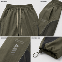 Private Label Herren Fallschirmhose Nylon Weites Bein Kordelzug-Bund Siebdruck Verstellbarer Saum Lässige Streetwear-Hose