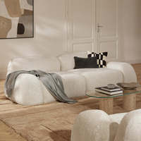 Canapé modulaire 3 places en tissu rembourré, style moderne et minimaliste, avec rembourrage en mousse, idéal pour appartement ou villa, décoration intérieure.